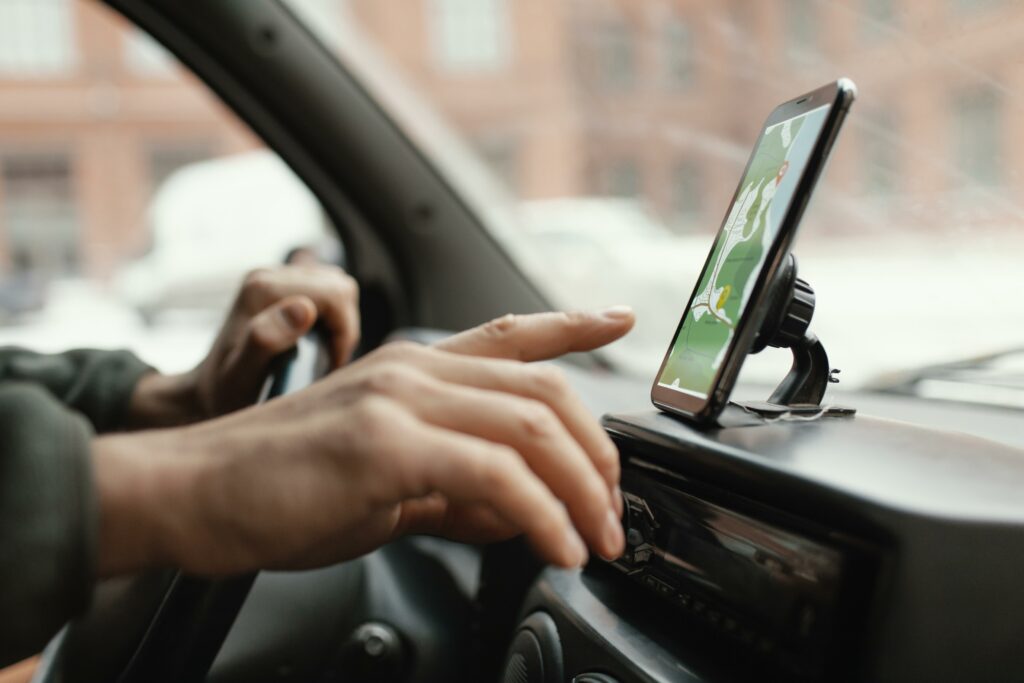 close-up-man-car-with-map-mobile